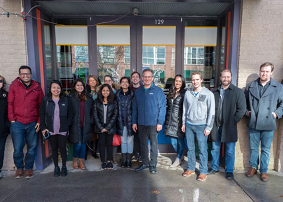 Members of the VAFC lab stand outside a restaurant on a sunny winter day