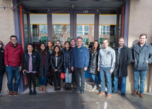 Members of the VAFC lab stand outside a restaurant on a sunny winter day